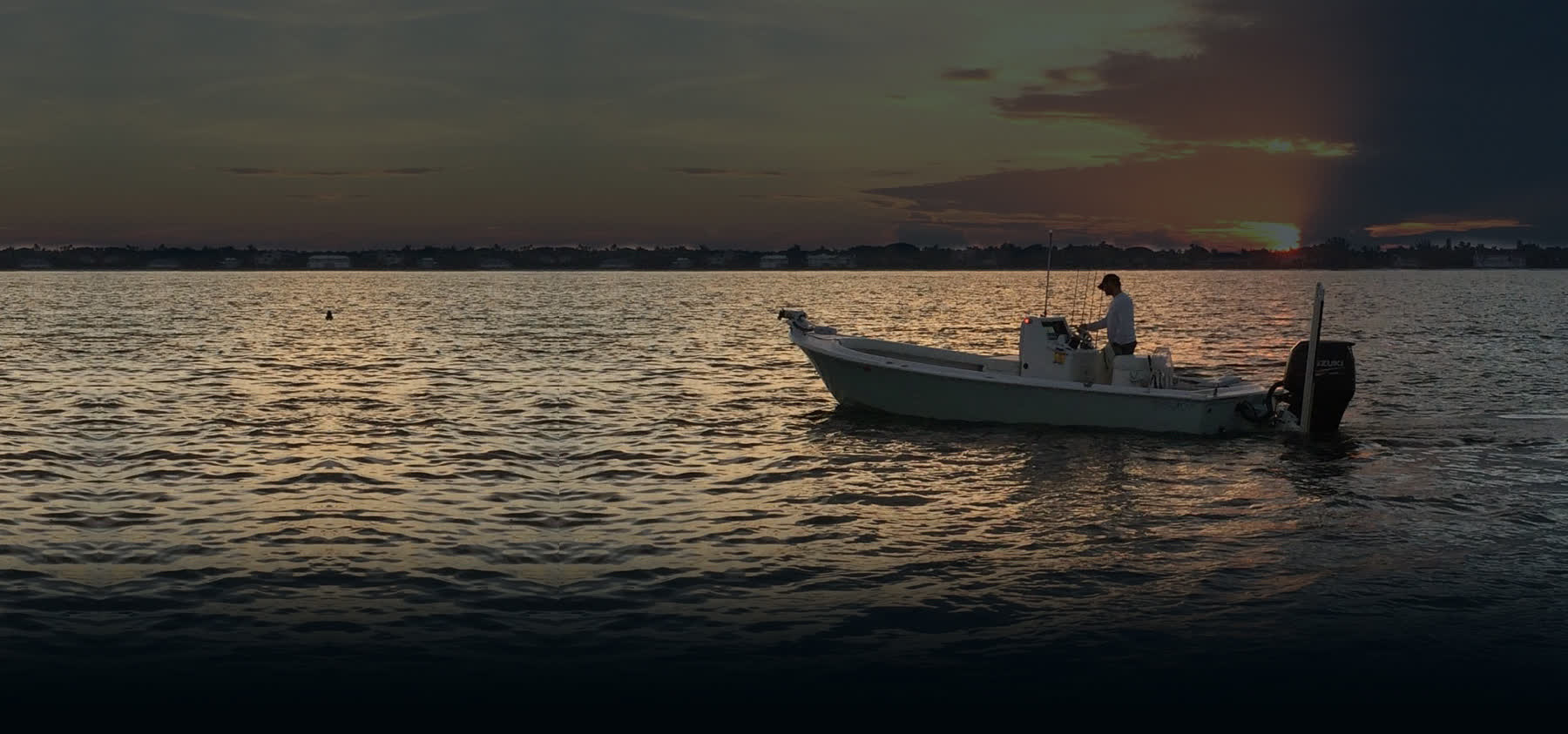 Captain Tony's skiff on the water at sunset in Naples, Florida